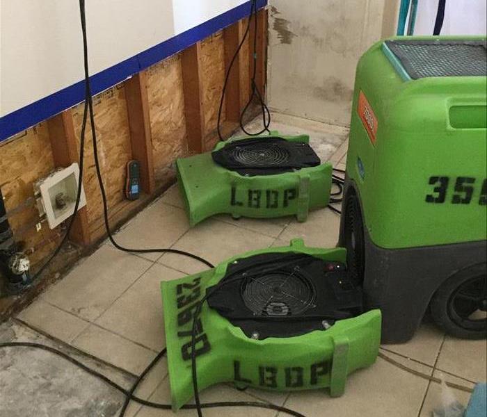 Drying equipment on floor and flood cuts.