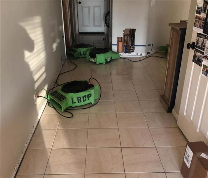 Air movers drying entry way. 