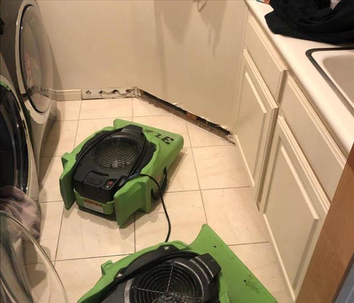 Air movers in a laundry room.