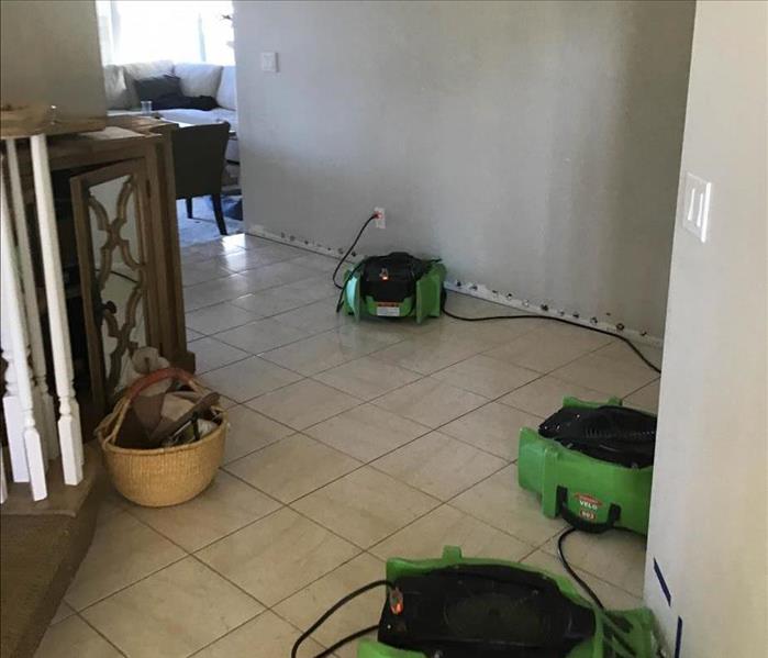 Drying equipment in hallway of home.