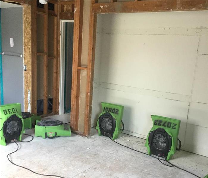 air movers placed inside a room to start restoration services after fire damage