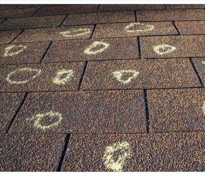 Marked hail damage on the roof of an insured party.